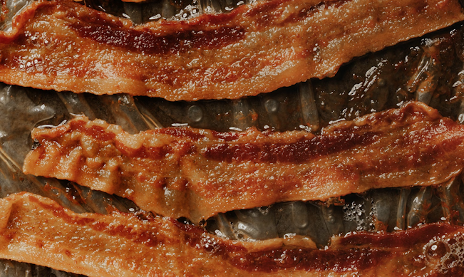 Please go to a hamburger restaurant and do this, and send me a picture. You will receive 50 points. That's a lot of points! Three slices of cooked bacon on parchment paper. There's a lot of grease.